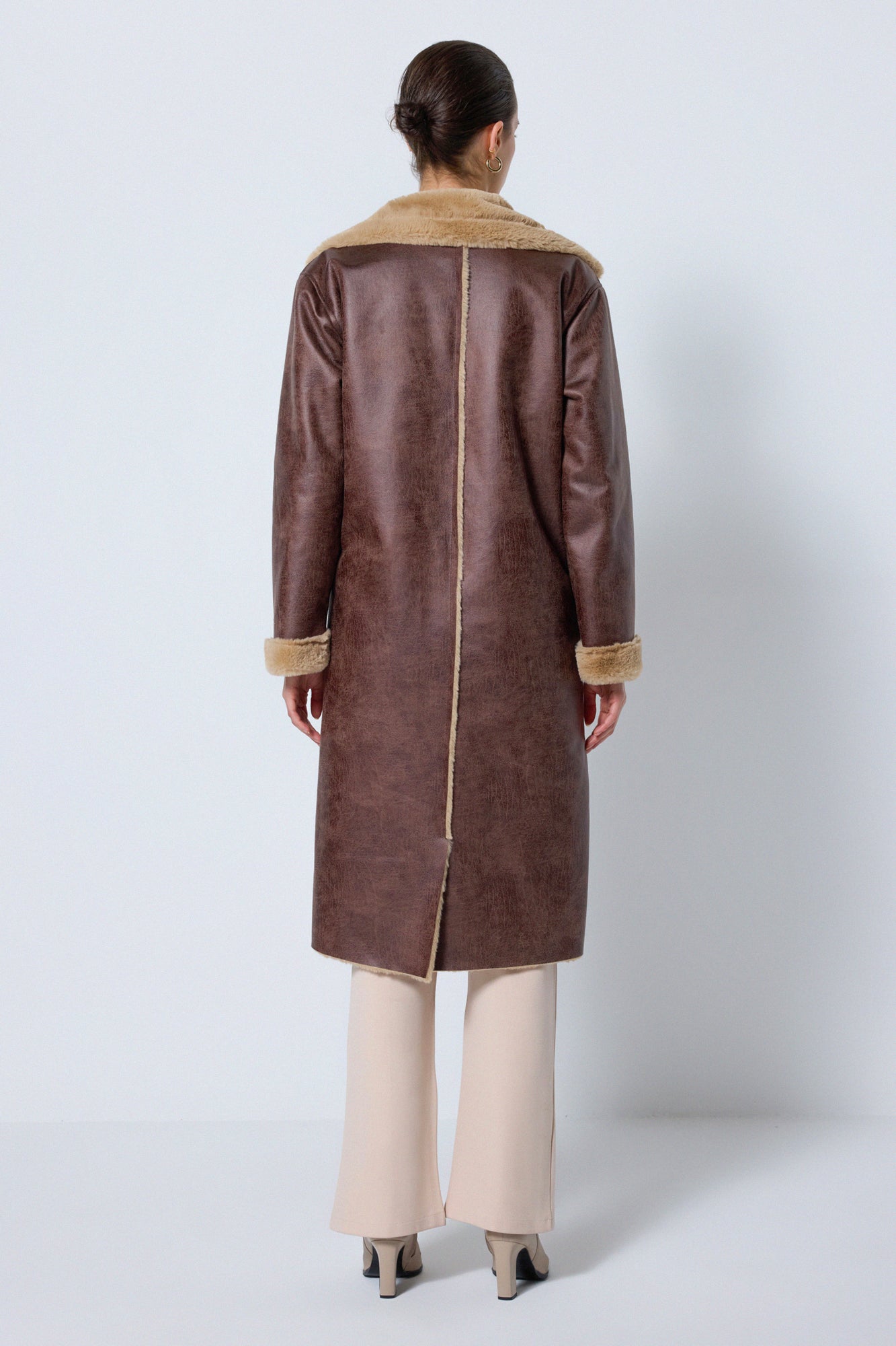 LEATHER COAT WITH FUR DETAILS