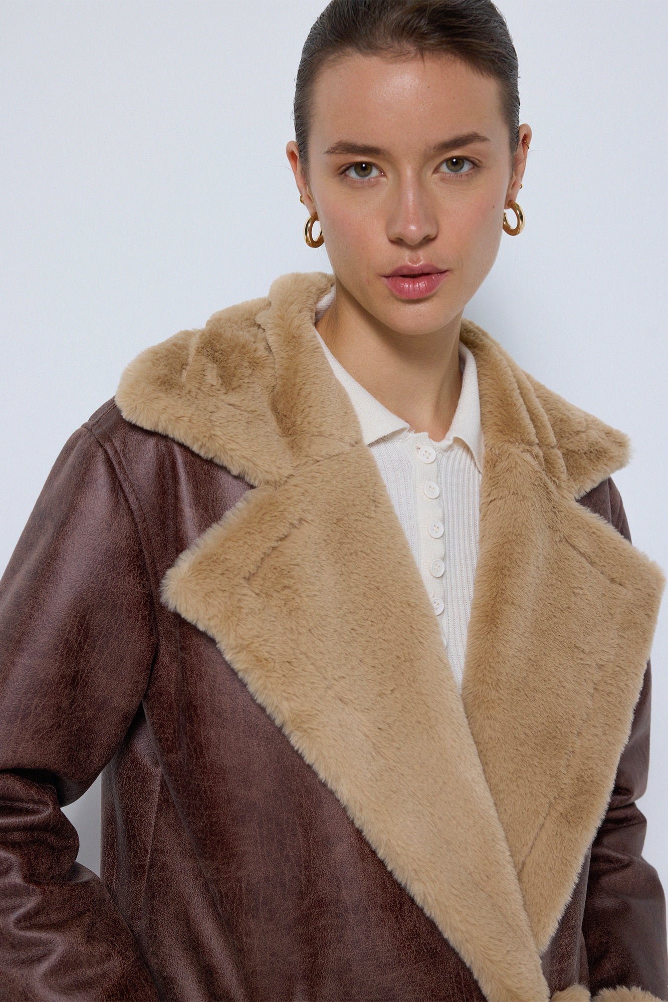 LEATHER COAT WITH FUR DETAILS